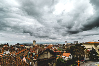 View of town against cloudy sky