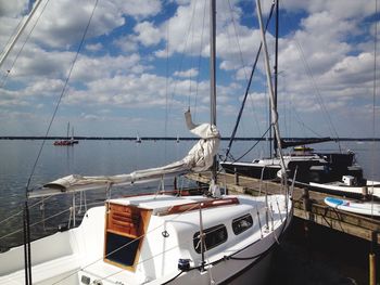 Boats moored at harbor