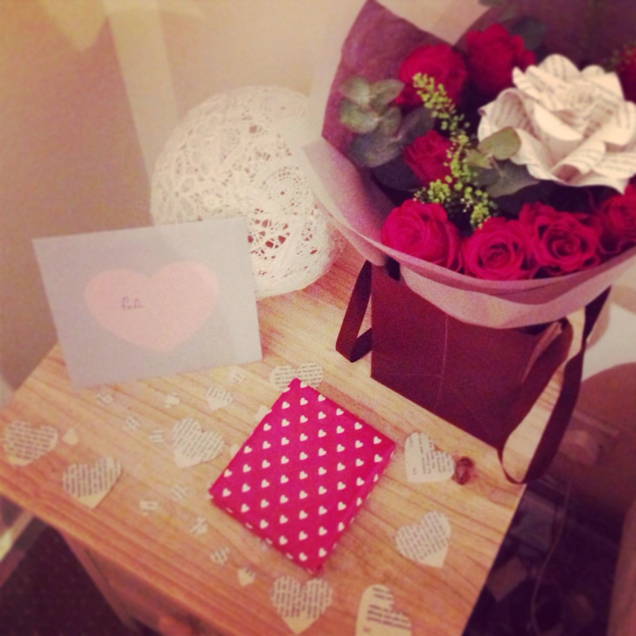 indoors, table, flower, still life, freshness, high angle view, vase, close-up, pink color, petal, home interior, decoration, no people, fragility, paper, tablecloth, variation, white color, flower arrangement, arrangement