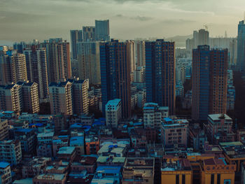 High angle view of buildings in city against sky