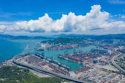 High angle view of city against cloudy sky