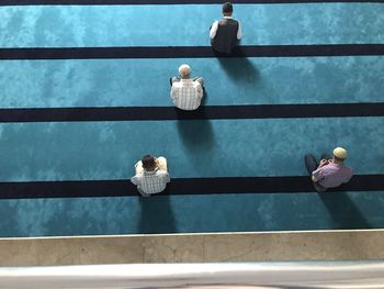 Directly above shot of men praying