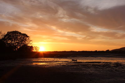 Scenic view of sunset over river