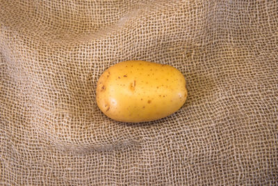 High angle view of egg on jute