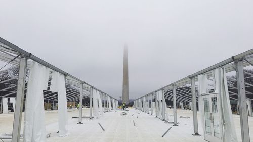 Monument against foggy sky