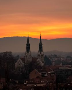 High angle view of illuminated buildings against sky during sunset