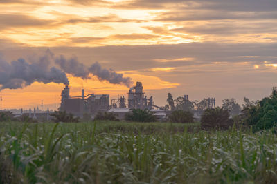 Scenic view of field against sky during sunset