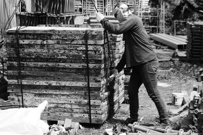 Rear view of man working at construction site