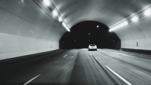 Illuminated tunnel at night