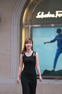 Portrait of a smiling young woman standing outdoors