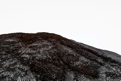 Close-up of mountain against clear sky