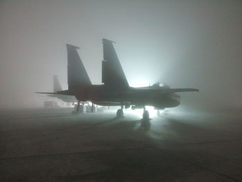 View of airplanes on runway in airport