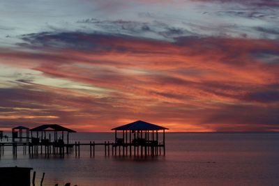 Scenic view of sea against orange sky