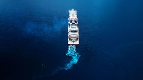 High angle view of lighthouse amidst sea