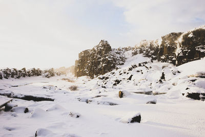 Scenic view of snow covered mountain against sky