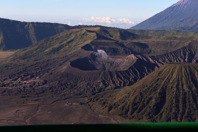 Scenic view of volcanic landscape against sky