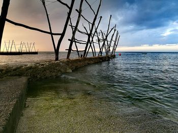 Scenic view of sea against sky at sunset