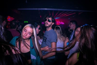 Group of people at music concert at night