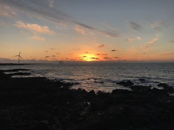 Scenic view of sea against sky during sunset