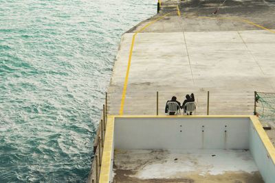 High angle view of men in sea
