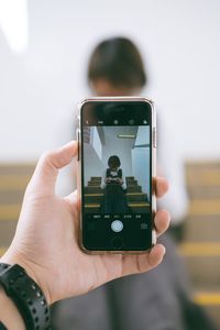 Close-up of woman using mobile phone