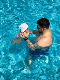 High angle view of man swimming in pool