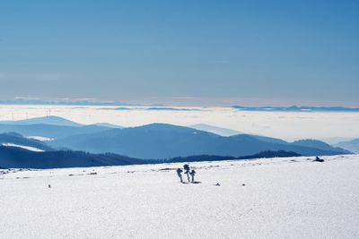 Scenic view of snowcapped mountains against clear sky