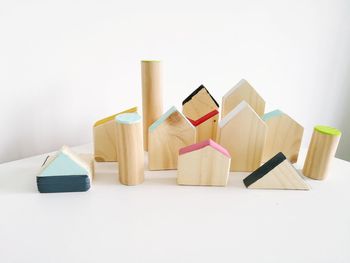 Close-up of wooden toy blocks on white table