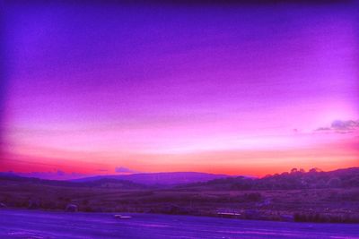 Scenic view of silhouette landscape against sky during sunset