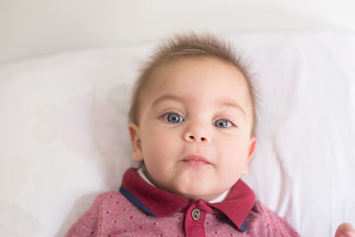 Close-up portrait of cute baby at home