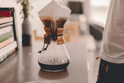 Close-up of coffee cup on table at home