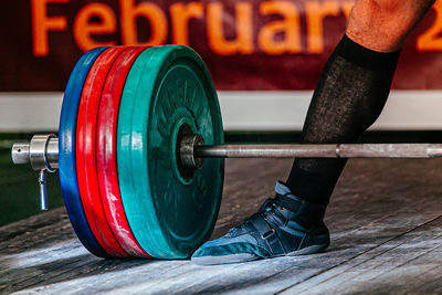 Low section of man exercising in gym