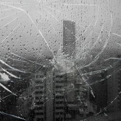 Full frame shot of wet glass window in rainy season