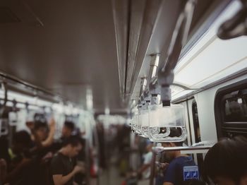 Close-up of handles in train