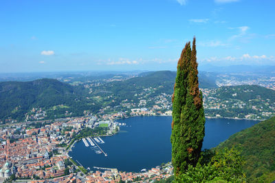 Aerial view of city against cloudy sky