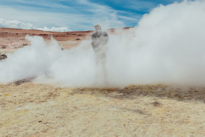 Man in smoke of hot spring