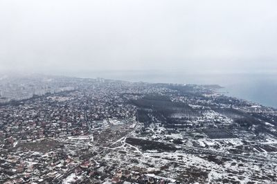 High angle view of buildings in city against sky