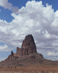 Rock mountain on landscape against sky