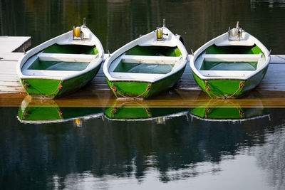 Boats moored in lake