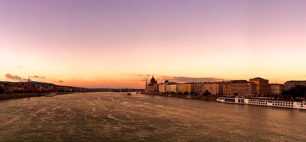 High angle view of danube river by hungarian parliament building at sunset