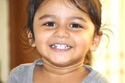 Close-up portrait of smiling girl