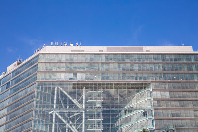 Low angle view of building against blue sky