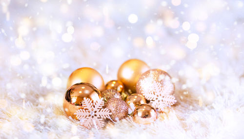 Close-up of christmas ornaments on fur