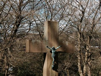 Crucifix against bare trees