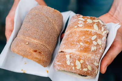 Close-up of hand holding dessert