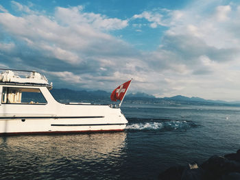 Boat moored in sea against sky