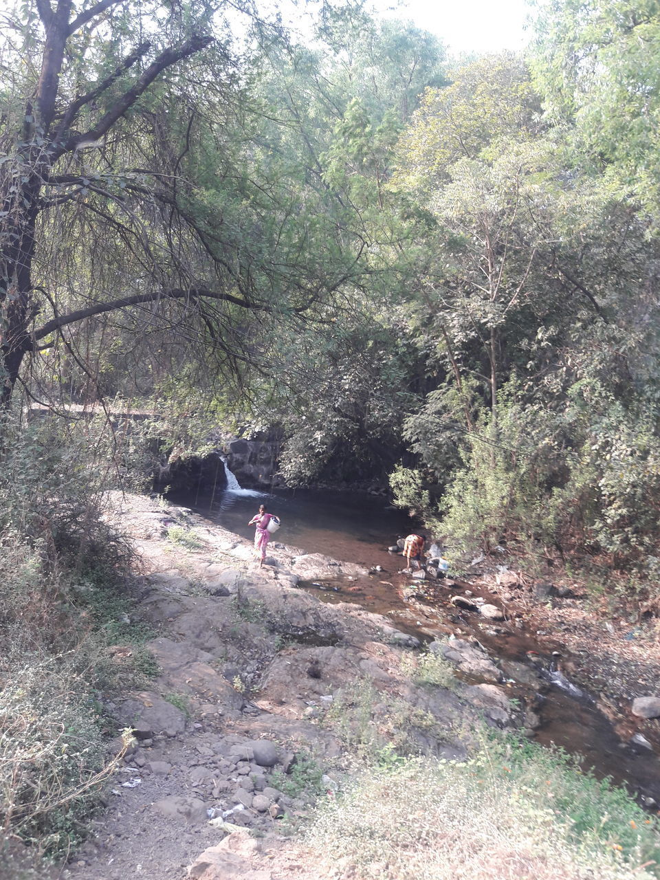 PEOPLE ON MOUNTAIN ROAD