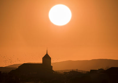 Low angle view of church against sky during sunset