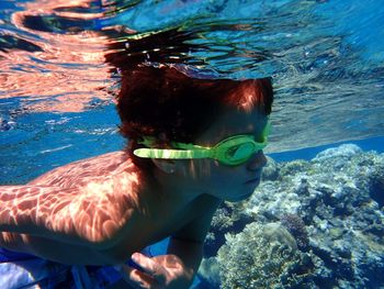 Boy swimming in sea