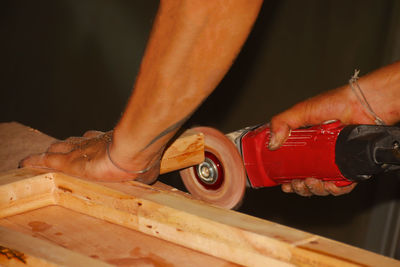 Close-up of man working on wood